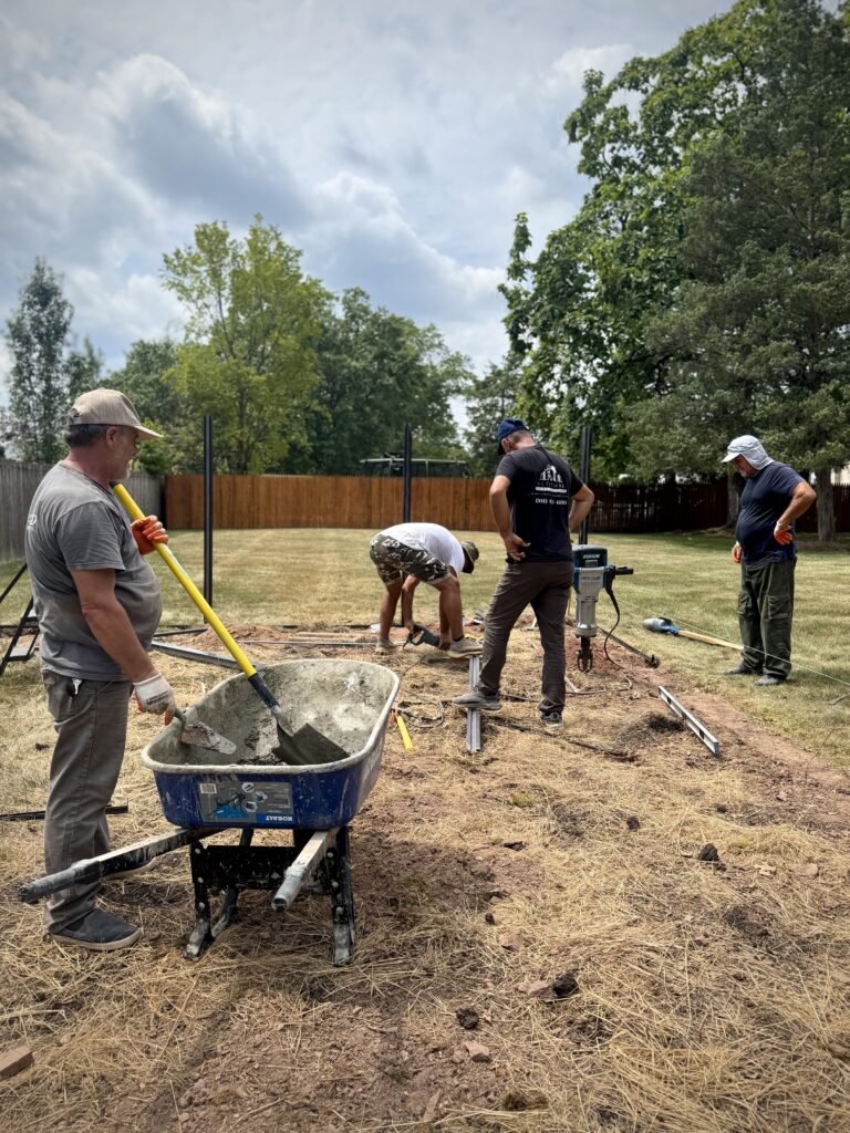 Altitude Construction's team building a composite fence